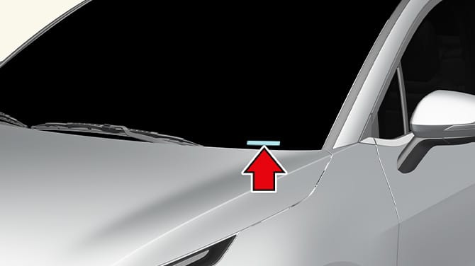 Close-up of a plate attached to the top of the dashboard