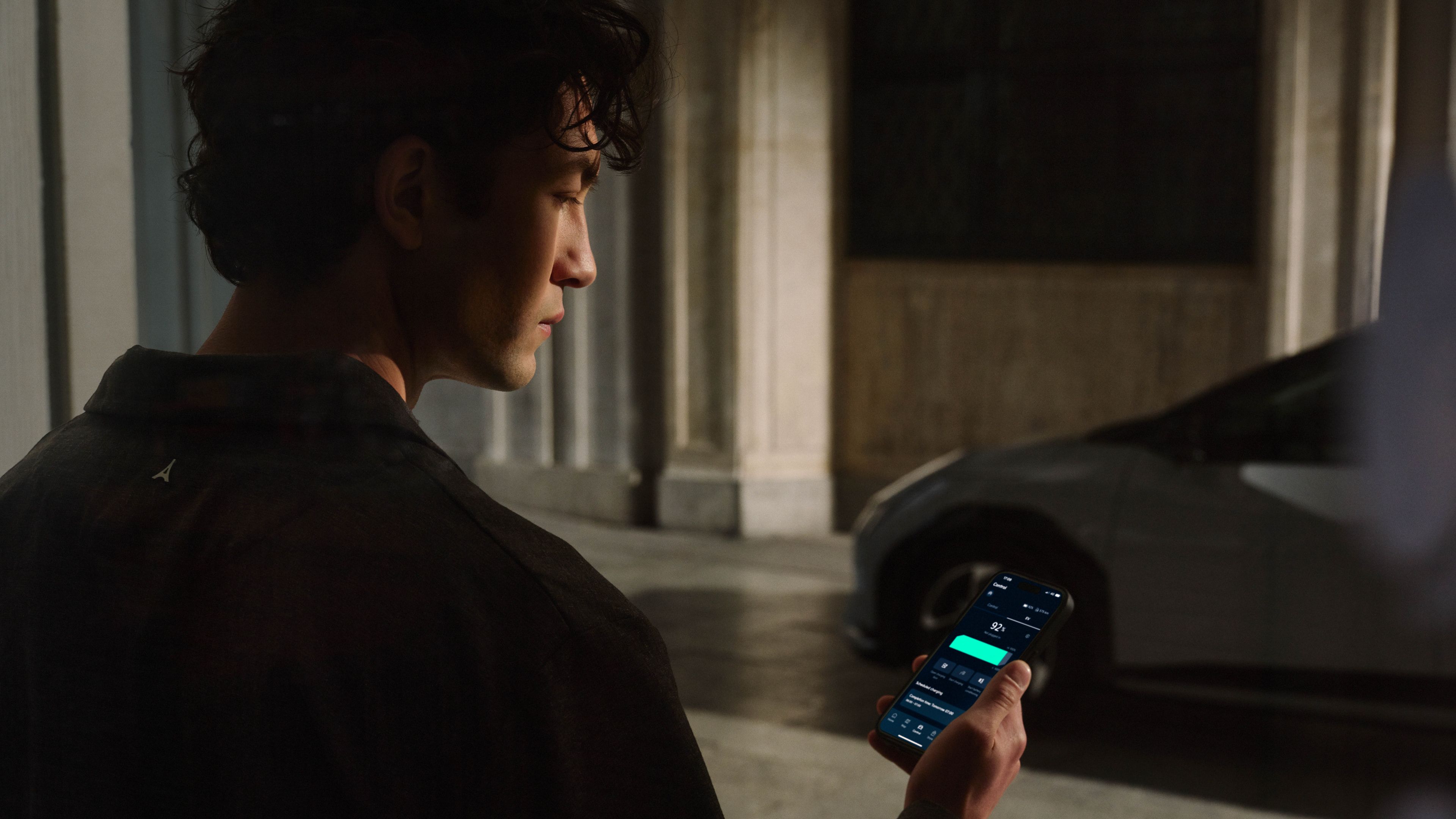 Driver inside a Kia vehicle using the Kia Connect app